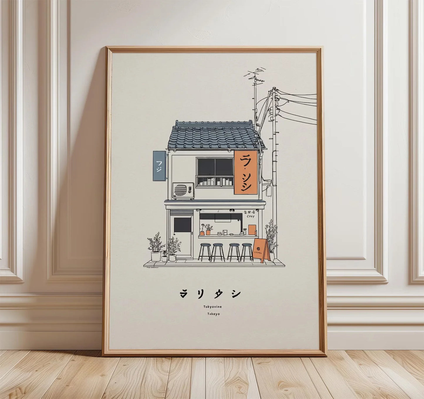 A framed art print leaning against a white paneled wall on a light wood floor. The print features a minimalist line drawing of a Japanese street cafe with a dark gray tiled roof, beige walls, and orange signage, with Japanese text and the English name 'Tatami' printed below.