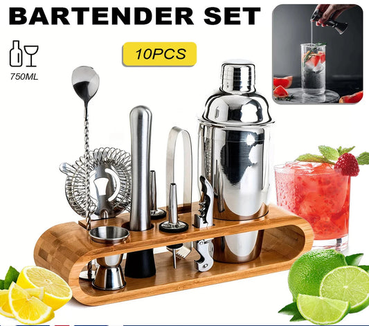 Bartender set with cocktail shaker and tools on a wooden stand, surrounded by cocktail ingredients.