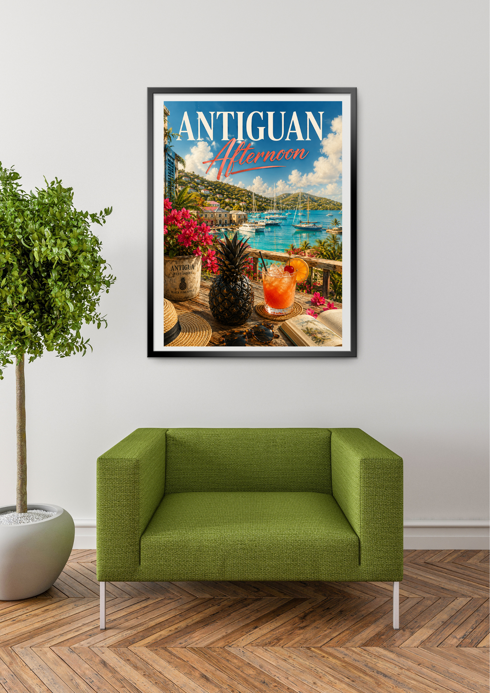 Framed travel poster of Antigua with a green couch and plant in the foreground.