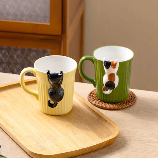 Two mugs with animal designs on a wooden tray.