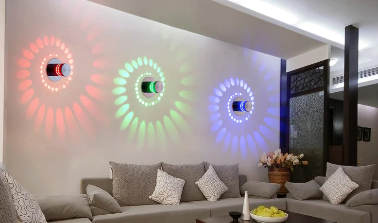 Living room with colorful wall lights and a sofa.