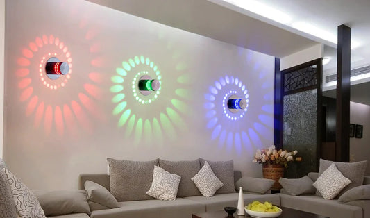 Living room with colorful wall lights and a sofa.
