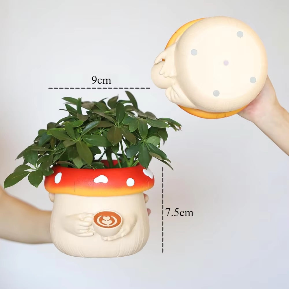 Mushroom-shaped planter with a small plant, held by a hand, with measurements indicated.