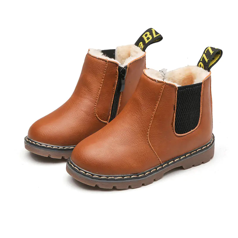 Pair of brown children's boots with black accents on a white background