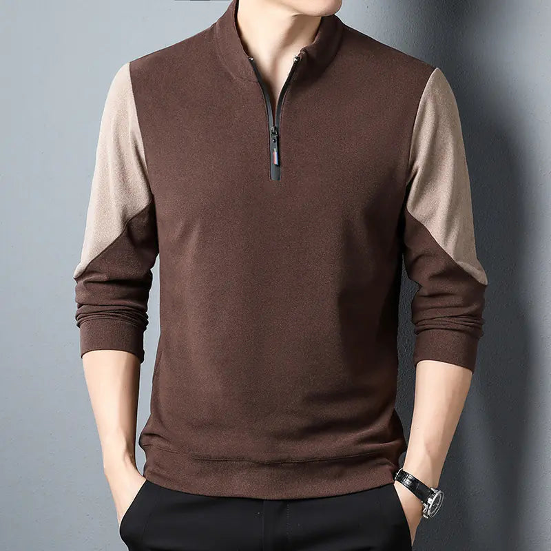 Brown and beige long-sleeve shirt with a zipper on a gray background