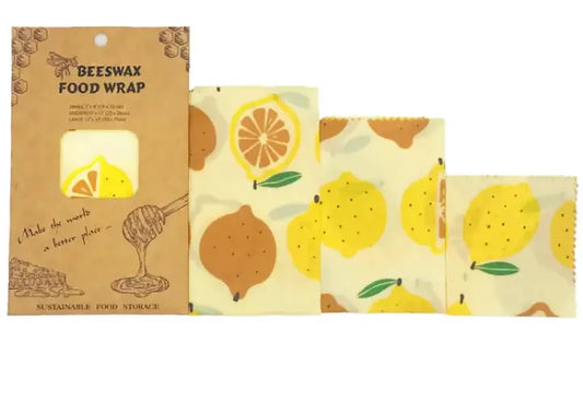 Set of reusable beeswax food wraps with citrus print, shown in four sizes and eco-friendly packaging