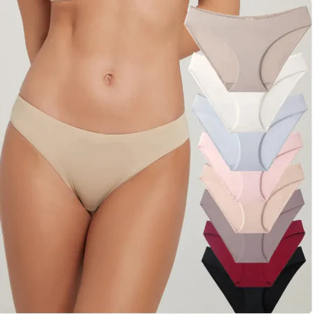 Beige underwear worn by a person with a stack of similar underwear in various colors on a white background.