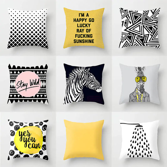 Collection of decorative pillows with various designs and text on a white background