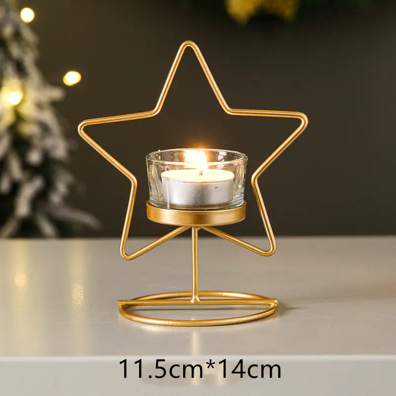 Gold star-shaped candle holder with a lit candle on a neutral background