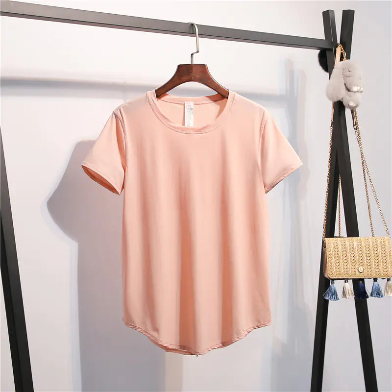Pink t-shirt on a hanger with a white background