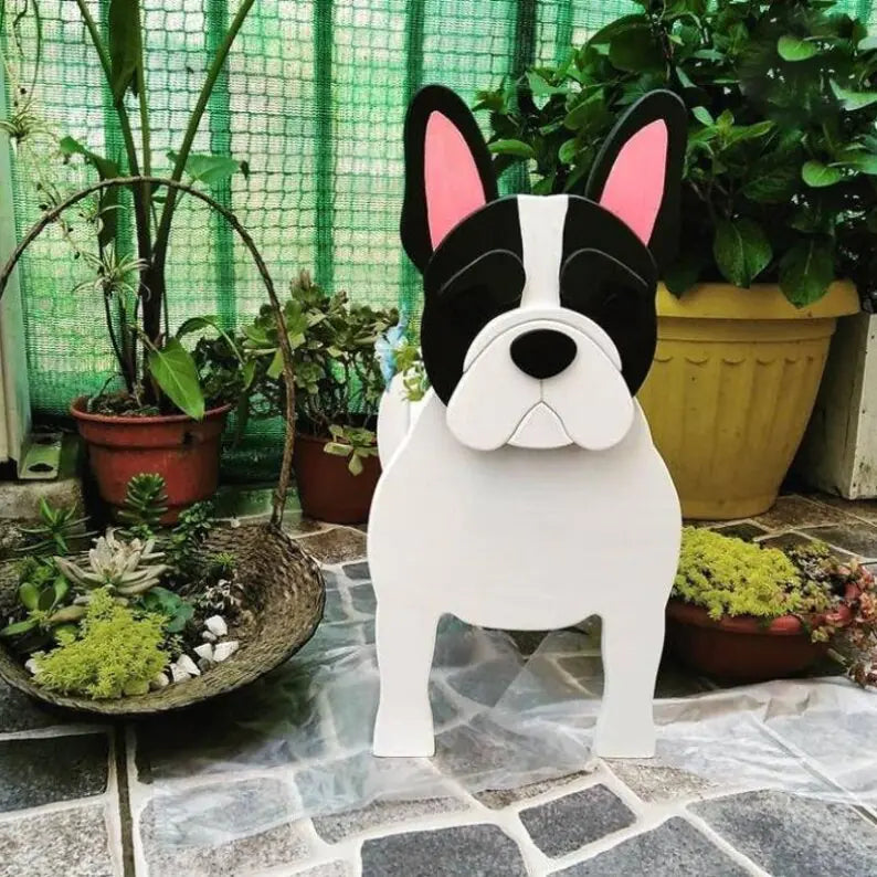 White dog-shaped decorative item on a stone patio with plants in the background