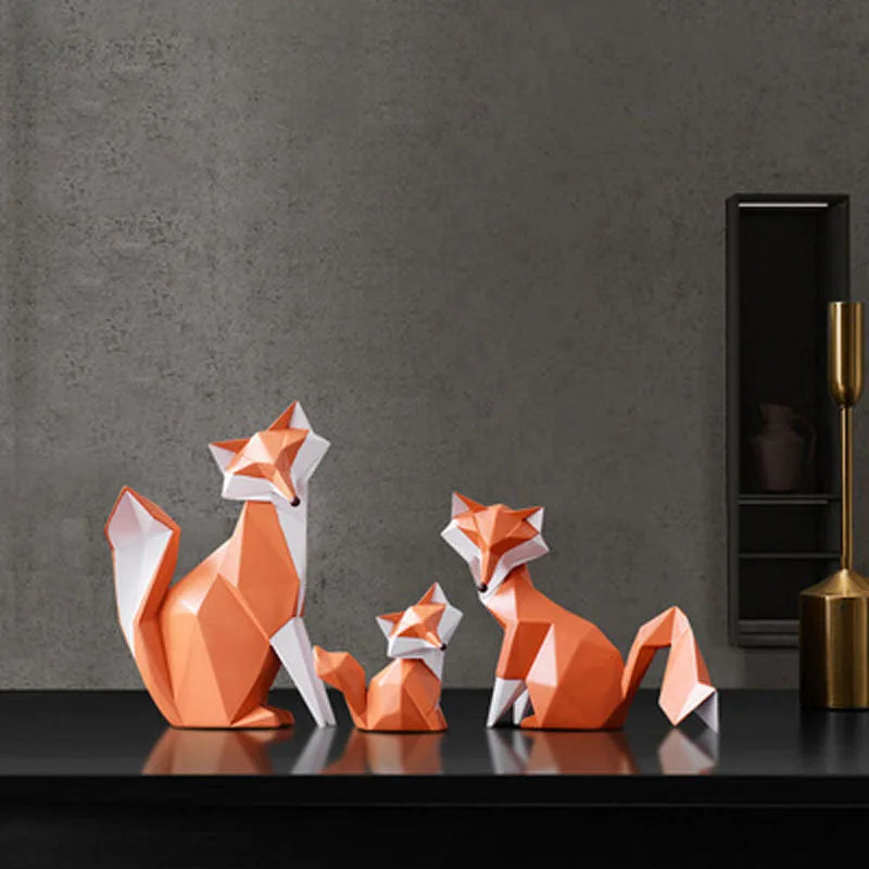 Geometric resin fox ornament set in modern low poly design displayed on shelf