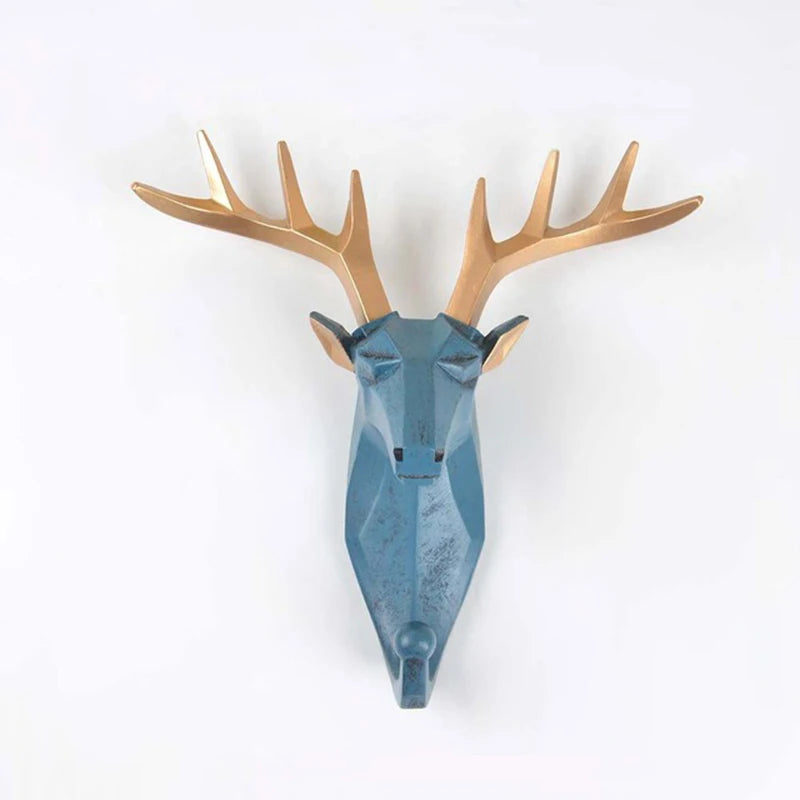 Decorative deer head hook  with blue body and gold antlers on a white background