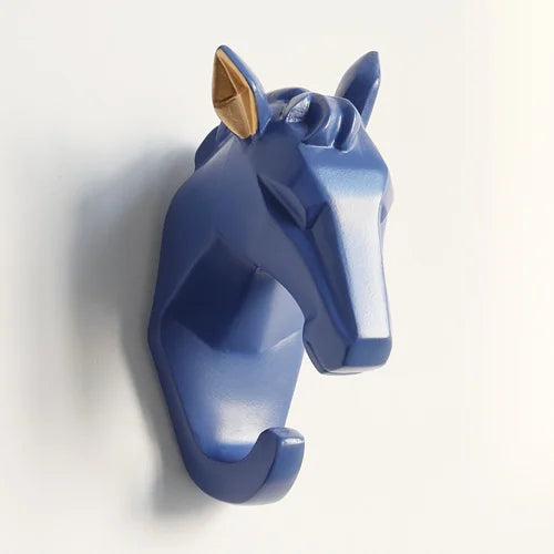 Blue horse head wall hook on a white background
