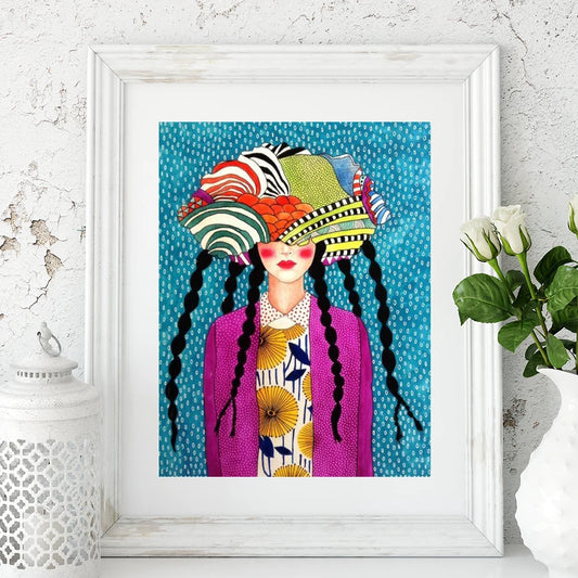 Framed artwork of a woman with a colorful hat and braids against a blue polka dot background.