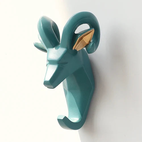 Teal ram head wall hook on a white background