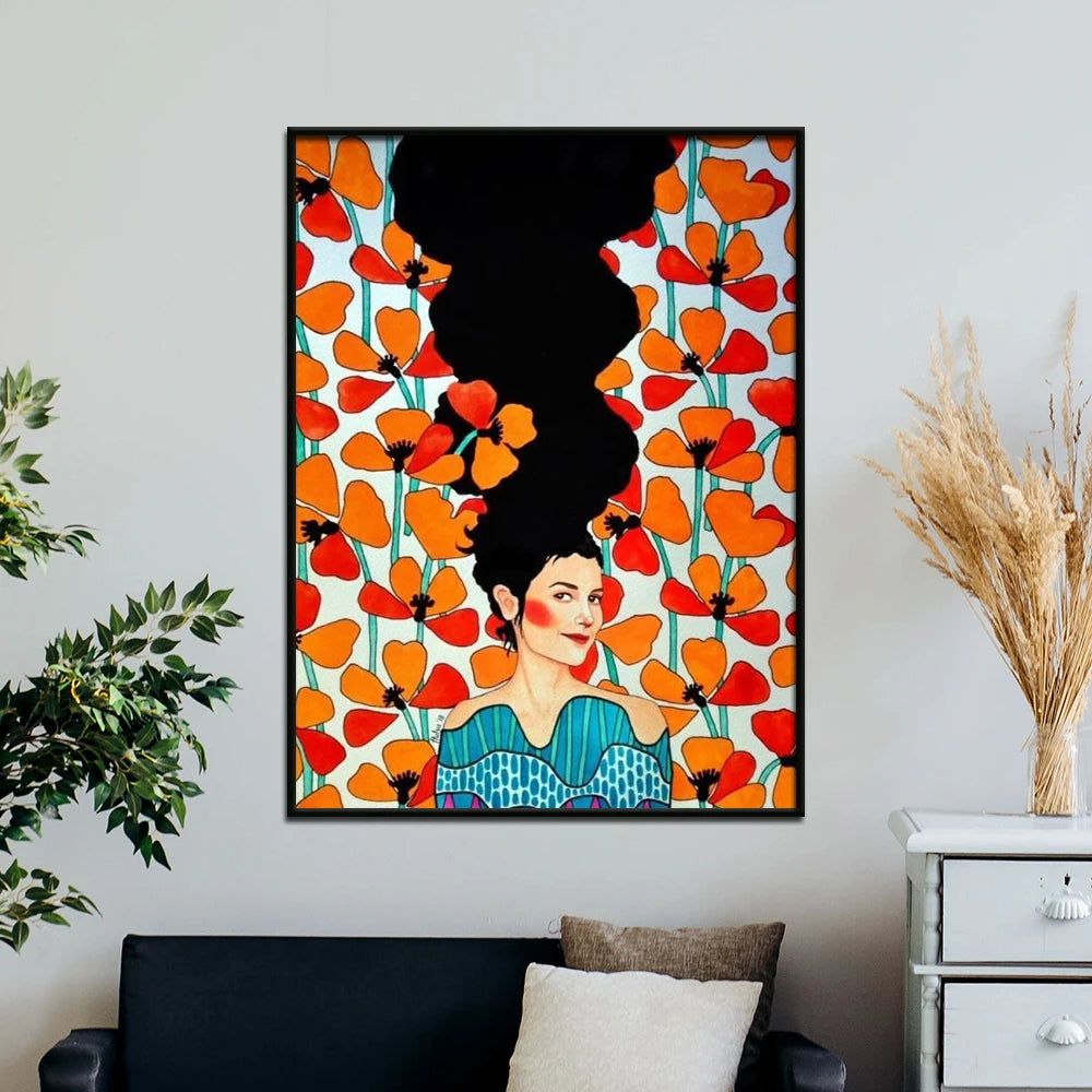 Framed artwork of a woman with flowers on a wall in a living room setting.