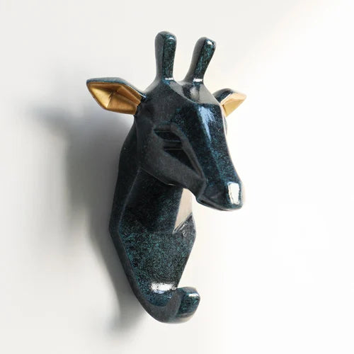 deer-shaped wall hook with a metallic finish on a white background