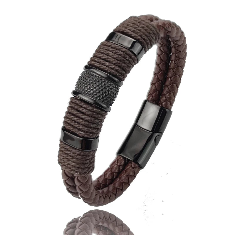 Brown braided bracelet with black metal clasps on a white background