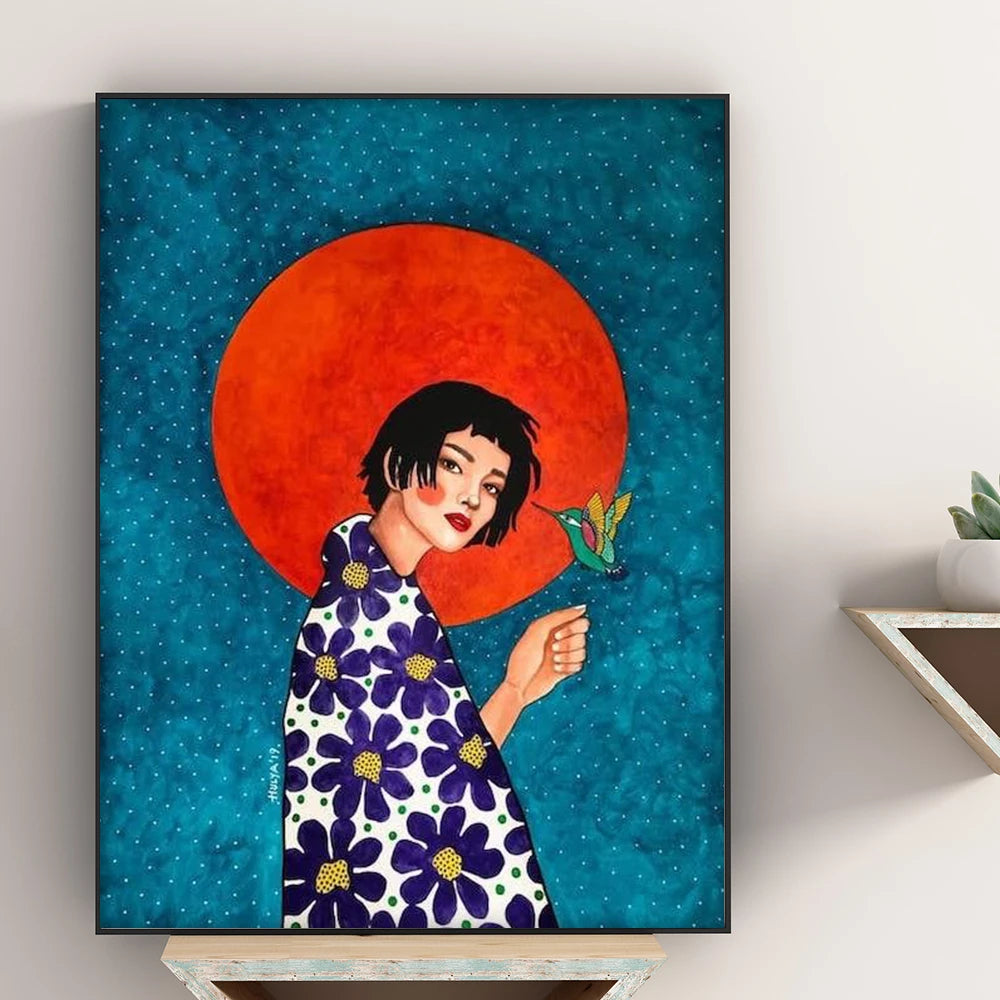 Framed artwork of a woman in a floral dress with a red circle and bird on a blue background