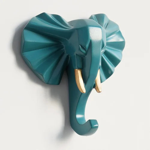 Teal elephant head wall hook on a white background