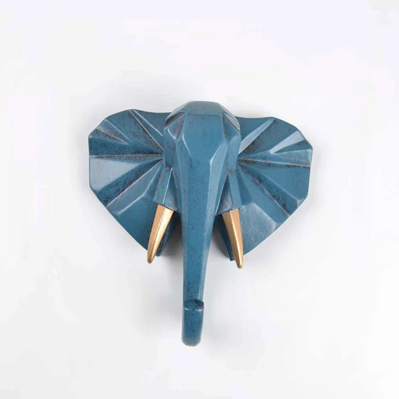 Blue elephant-shaped wall hook on a white background