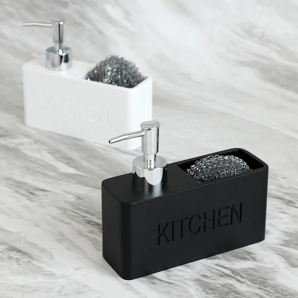 Black kitchen sink caddy with soap dispenser and scrubber holder on a marble countertop.
