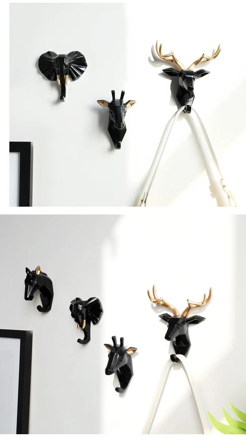 Set of animal-themed wall hooks on a white background