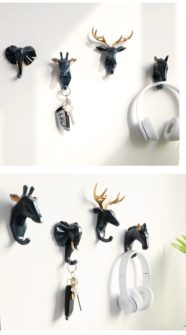 Wall hooks shaped like animals with various items attached on a white background