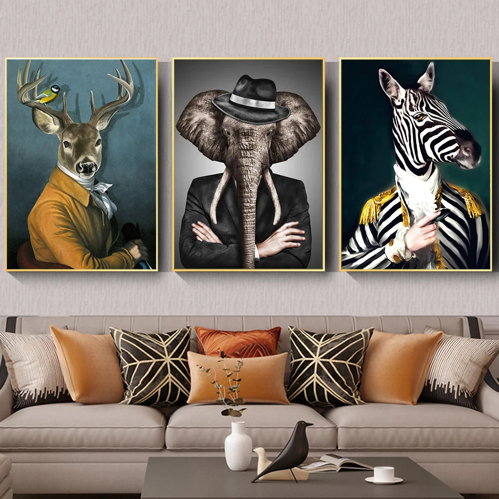 Three framed animal portraits above a sofa with decorative pillows.