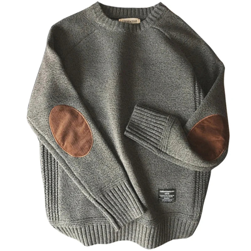 Gray sweater with brown elbow patches on a white background