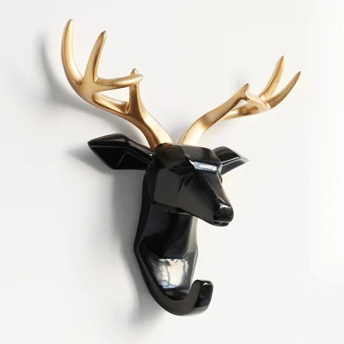Decorative deer head with gold antlers on a white background