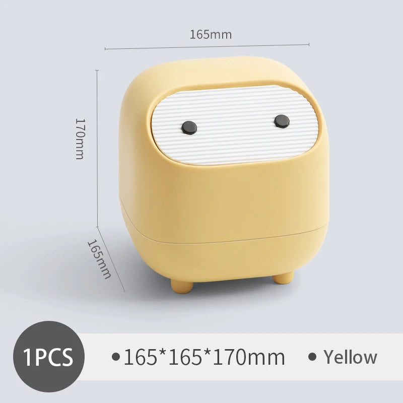 Yellow rectangular device with rounded edges and black buttons on a light gray background