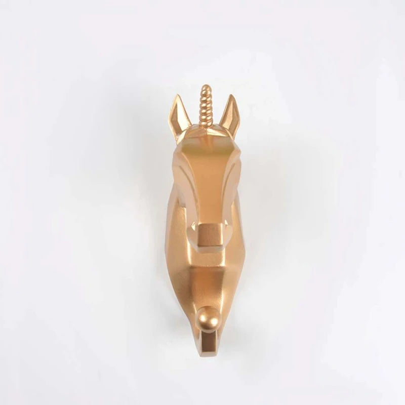 Gold deer head hook on a white background