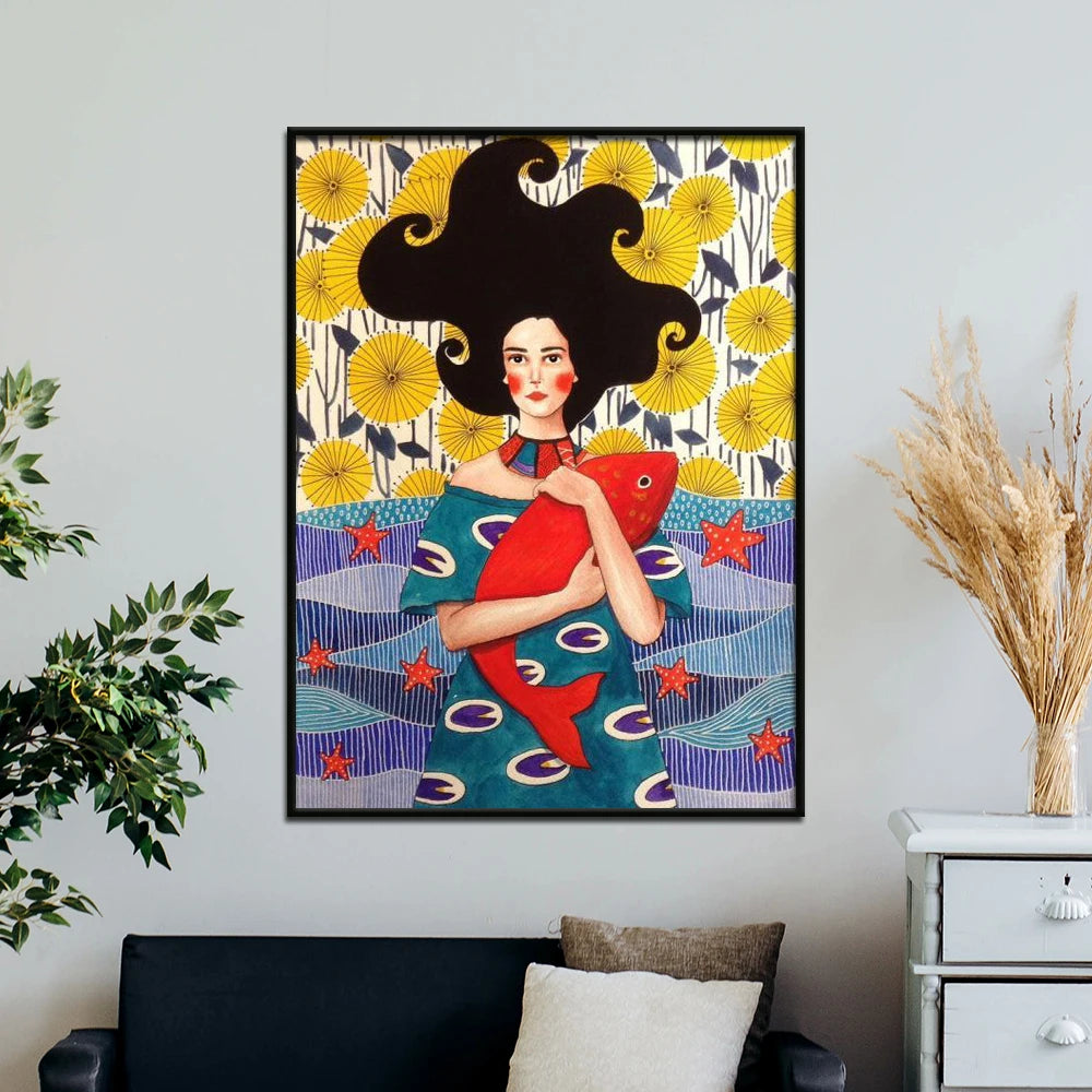 Framed artwork of a woman holding a fish with a colorful background on a wall above a sofa.