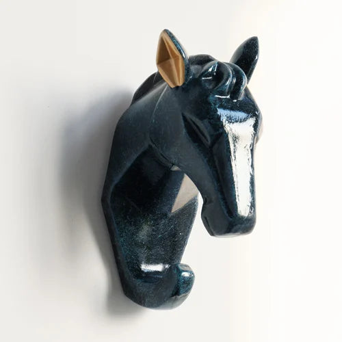 Decorative horse head sculpture on a white background