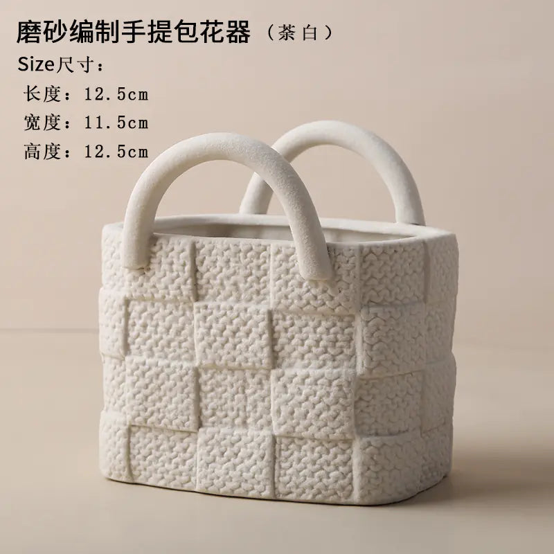 White woven basket with handles on a beige background