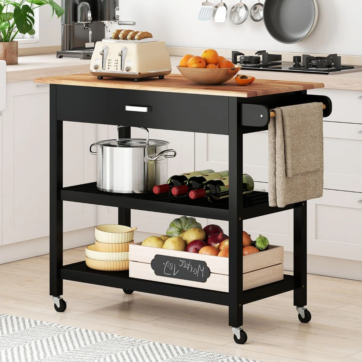 Black kitchen cart with wooden top in a kitchen setting