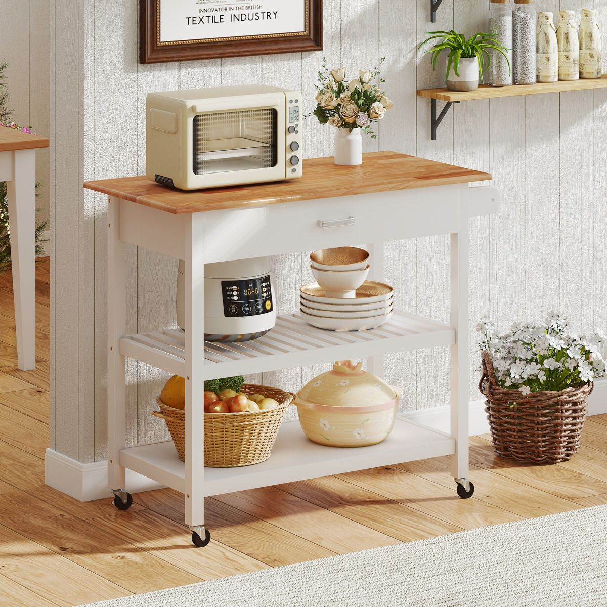Kitchen island with wooden top and white base, featuring appliances and decor.