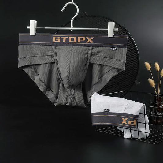 Gray boxer briefs on a hanger with 'GTOPX' branding against a dark background.