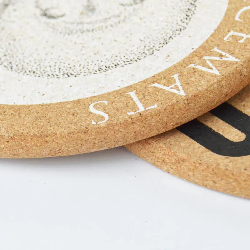 Close-up of a cork mat with 'CORKMATS' branding on a white background