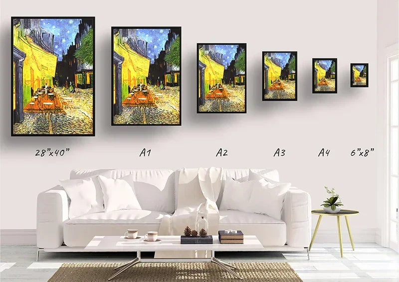 Set of Van Gogh-style paintings displayed on a wall above a white sofa.