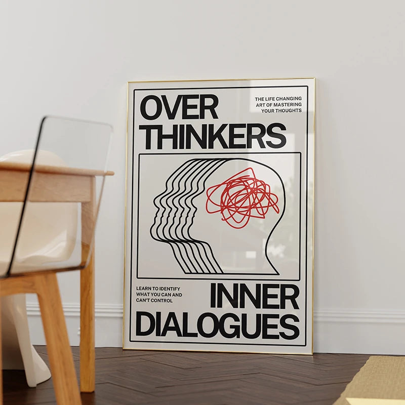 Framed poster titled 'Over Thinkers: Inner Dialogues' on a wall.