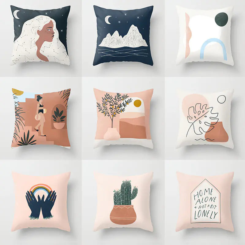 Collection of decorative pillows with various designs on a white background