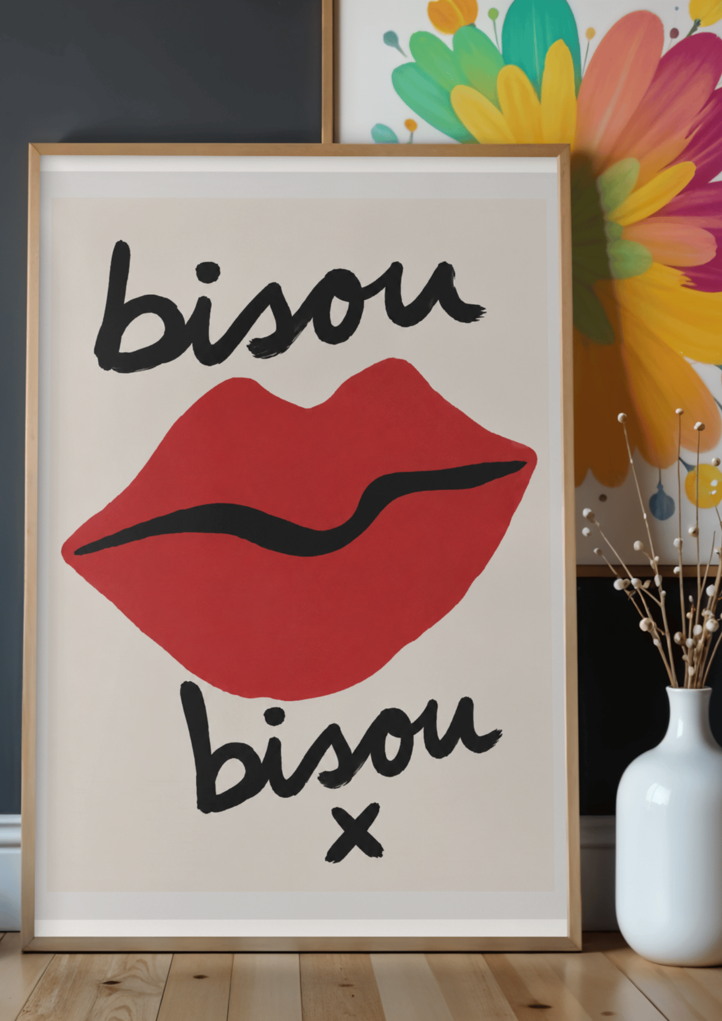 Framed artwork with red lips and 'bisou bisou x' text in a room setting.