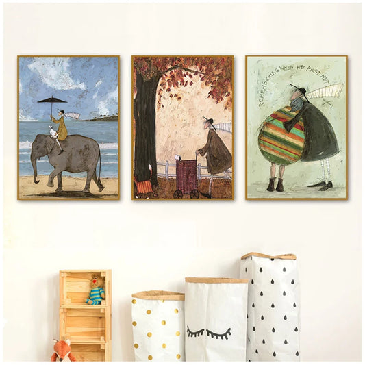 Three framed artworks on a wall with storage bins below.
