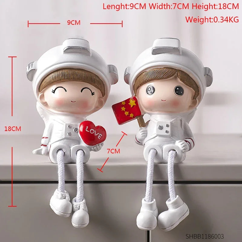 Two small figurines of children in astronaut suits with measurements and text on a white background