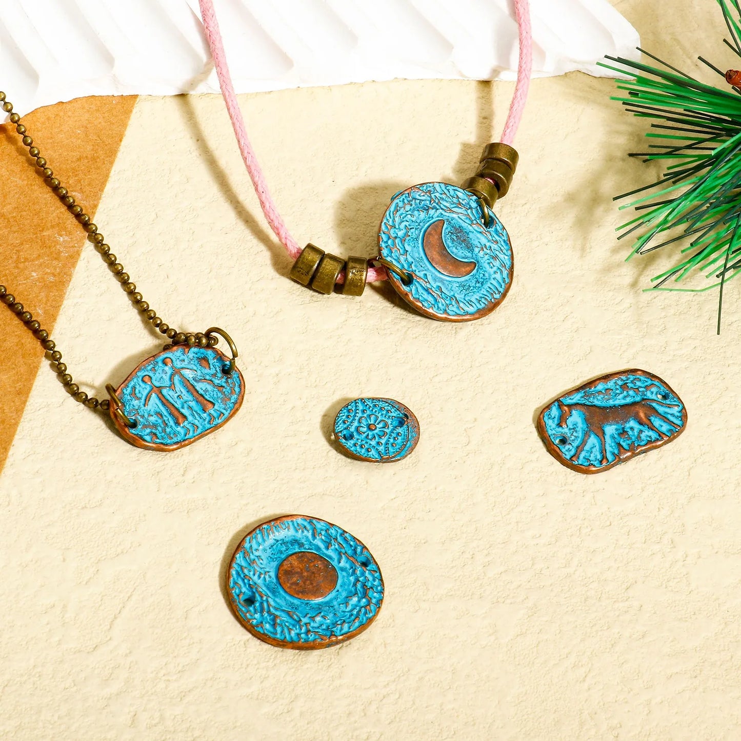 Blue patina metal jewelry connectors with bohemian moon, floral and geometric designs