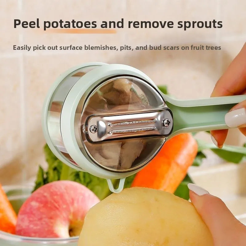 Vegetable peeler being used on a potato with fruits and vegetables in the background
