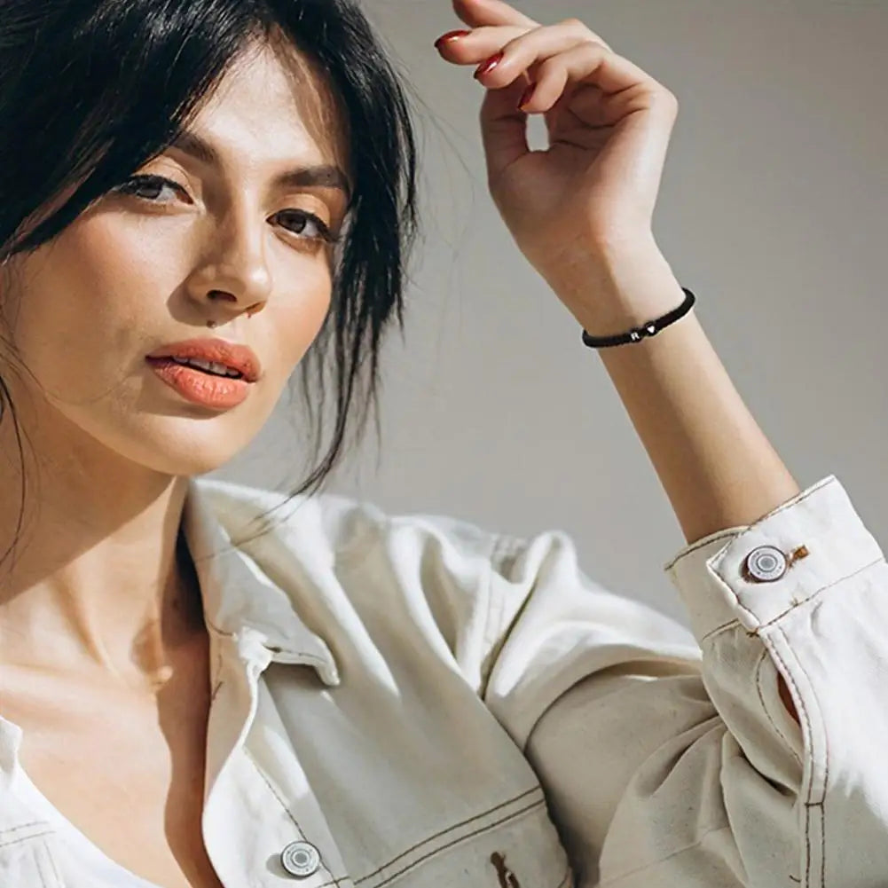 Woman wearing a beige shirt with a neutral background